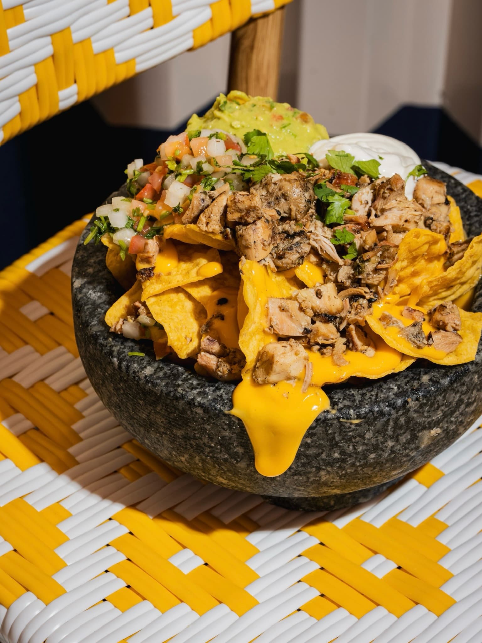 Loaded nachos with guacamole, pico de gallo and sour cream